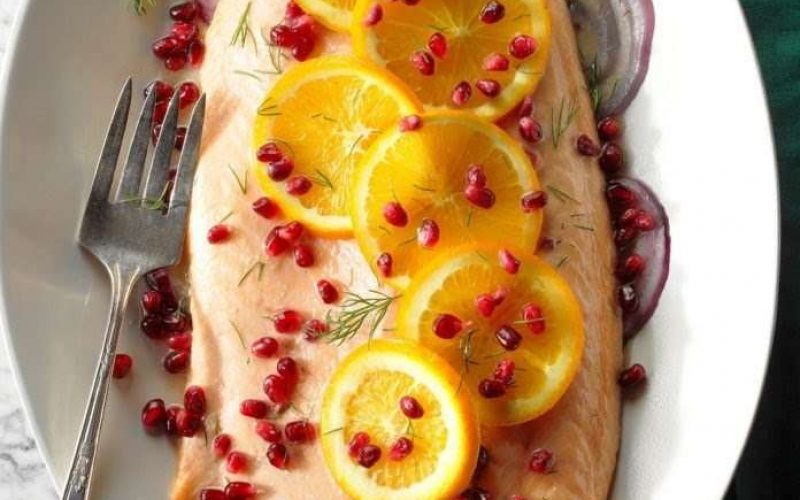 fish cut seasoned with oranges and pomegranate